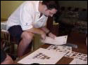 Thinking through his experience while creating a collage
